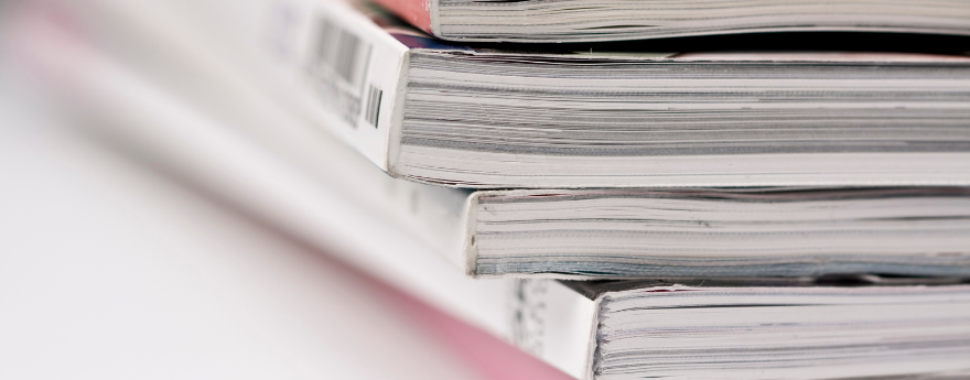 A closeup of a small stack of journals.